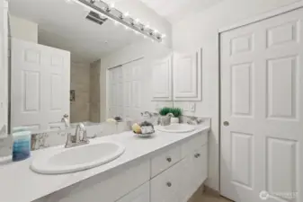 Dual sink vanity with door to walk in closet