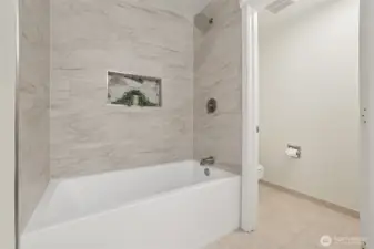 Renovated primary soaking tub and shower