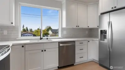 Window over the sink offers so much light.