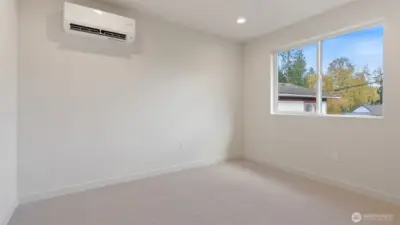 One of 2 main floor bedrooms.