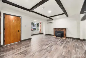 Looking back toward the front door and the wood-burning insert.