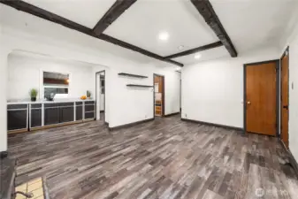 From the woodstove, you'll notice the dining area with built in storage on the left. The kitchen is straight ahead and has potential to remove the small wall and open up the floorplan.