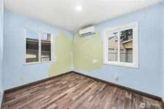 Bedroom 2 on the main level. The house needs interior painting, but otherwise is move-in ready.