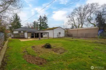 The lot is fully fenced, including a gate across the driveway. The garden space is shown in this picture - immediately behind the garage, in a separately fenced area.