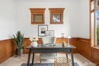 Main-floor office features majestic wainscoting and extensive, detailed millwork