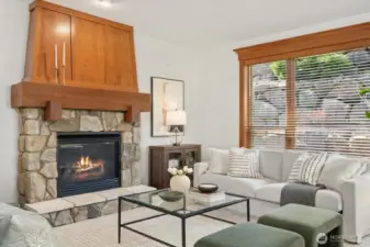 Family room impresses with dramatic floor-to-ceiling stone-and-wood gas fireplace & picture window. Great for cold days and long winter nights! Adds an additional touch of warmth!