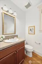 Conveniently located beautiful main-floor powder bath with hardwoods and beautiful tiling!