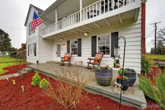 Covered front porch & above shows the veranda you step off of from the primary bedroom.