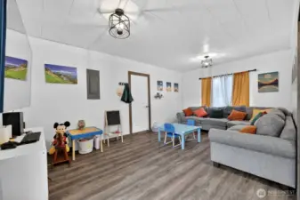 This is the large family room with updated fixtures and laminate flooring.