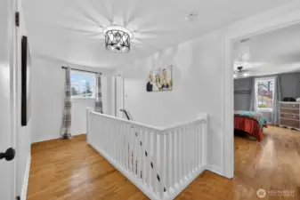 Upstairs landing, also hardwood flooring upstairs.