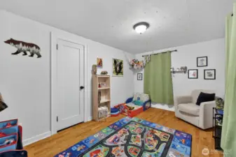 Bedroom 1 with hardwood floors.