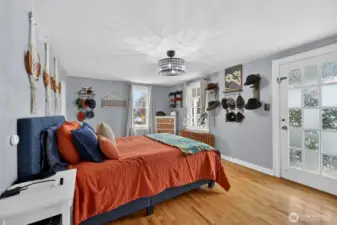 Other angle of the primary bedroom. The veranda (upsstairs balcony) is right through that door.