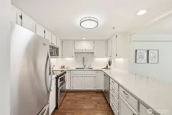 Updated kitchen with quartz countertops & stainless appliances