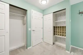 Spacious primary bedroom with custom closet systems.