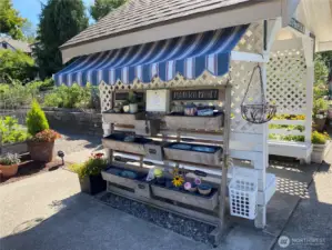 Pea patch sells fresh produce and flowers to residents, with proceeds donated to a local food bank.