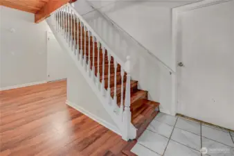 Staircase leads upstairs from entryway to main living spaces.