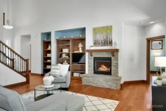 Great room with gas fireplace and built-in bookshelves.