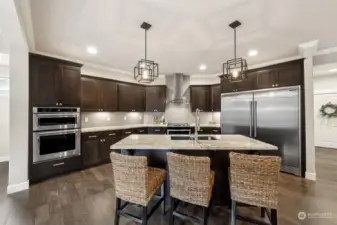 Yes, the fridge/ freezer is massive! Double ovens (one wall, one in range).