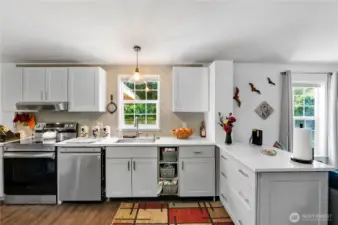Light filled Kitchen with plenty of storage with the beautiful newer cabinetry