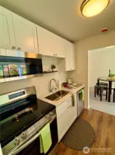 Shaker style cabinets, and stainless steel appliances.