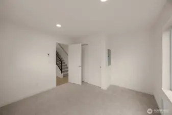 Photos of model home with similar finishes & floor plan. This room’s layout offers seamless flow to the stairwell, closet, and natural light from multiple windows.