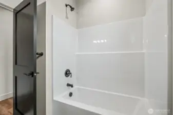 Bathtub shower combo in full bathroom