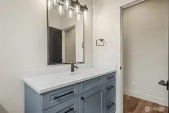 Powder room with toilet and sink for living and hosting