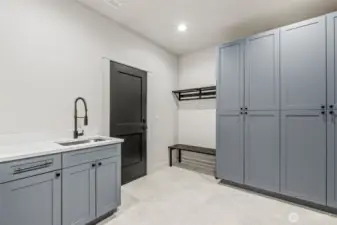 Mudroom leading in from the spacious 2+ car garage for laundry and additional storage
