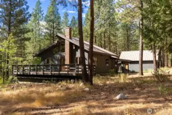 NE Corner of this home sillouette profile on mostly level 5 Acres.