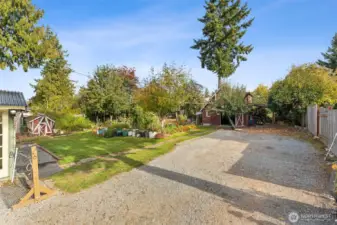 Long driveway leads to the Barn/Detached garage & carport.
