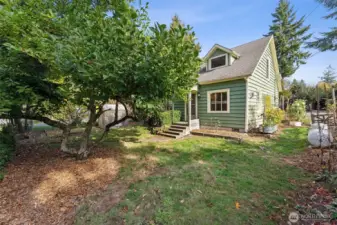 Charming home and grounds...beautiful plantings waiting for your green thumb! Welcome Home!