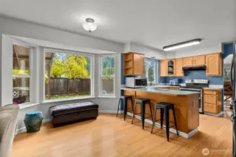 Large garden windows and informal eating area.