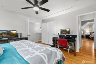 Upstairs bedroom with adjoining five piece bath. Has French doors and walk way over to bonus room with more closet space.