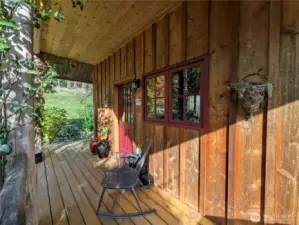 This covered porch wraps around to a great deck for long summer dinners and wintertime stargazing.