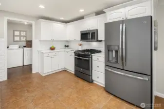 A Chef's Dream with Gas Range & Stainless Steel Appliances