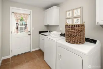 Laundry/Utility Room with Doors Leading to Backyard + Garage