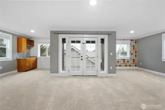 Fantastic bonus room with wet bar and French doors to the covered deck for year-round enjoyment.