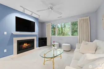 Living room with fireplace and large window