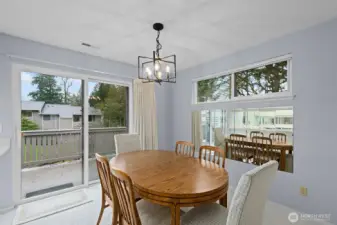 Dining Room with privacy window and glass door to private deck