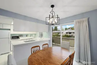 Dining with eating bar and kitchen