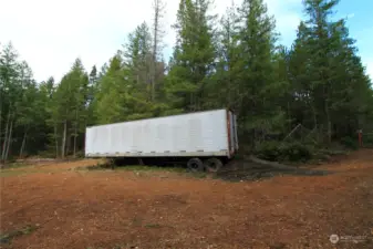 Trailer included with property.