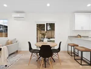 Space for a dining table along with the breakfast bar.