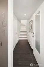 Open the door to 101 and you know you’re someplace special. Each stair step is custom lit to welcome you home. Most all flooring is real hardwood.
