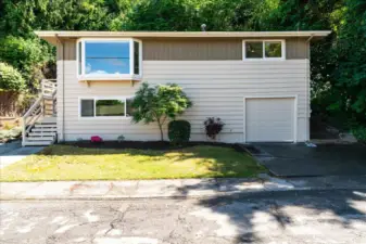 Newer vinyl windows and new garage door add to the overall home aesthetics