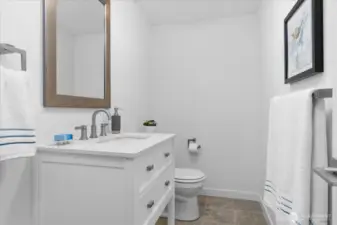 Lower level 1/2 bath, could be converted to a 3/4 bath offering a multitude of options for future rental income