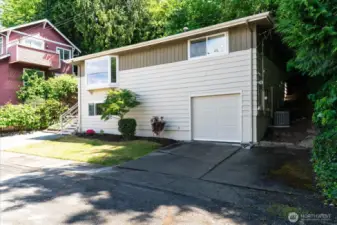 A one car garage with new garage door, and  two car driveway, plus two additional parking spots allow for off-street parking for visitors