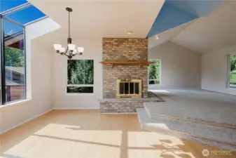 Natural light and soothing architecture embrace you. Cathedral ceilings in the family room create an open, airy feel. A double-sided fireplace connects the family room to the light-filled dining area. This blend of space and light transforms the home into a serene sanctuary, perfect for gatherings or quiet moments.