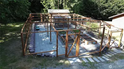 fully netted area can protect plants from pests, allowing them to thrive. Dedicate spaces for herbs, vegetables, and pollinator-attracting flowers. With two gates, enjoy an easy flow making your garden a personal haven.
