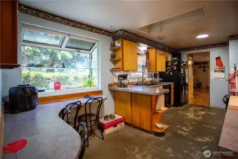 built in eating nook garden windows, skylight, needs flooring through out.