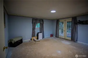 large main bedroom with French doors to private covered porch